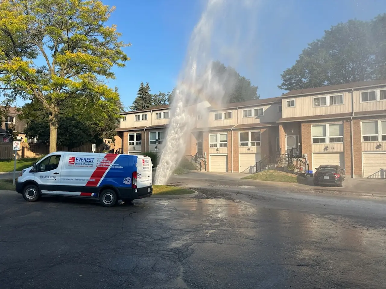 Licensed plumbing contractors performing emergency underground water main break repair